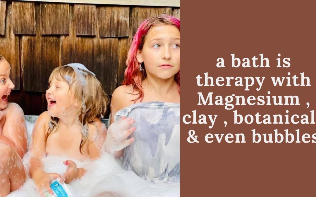 Children laughing in a bubble bath: a bath is therapy with magnesium, clay, botanicals and even bubbles