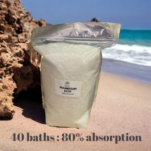 Large bag of magnesium bath flakes on a beach: 40 baths