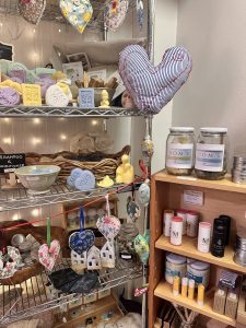 Shop shelves displaying heart soaps, magnesium products and sachets