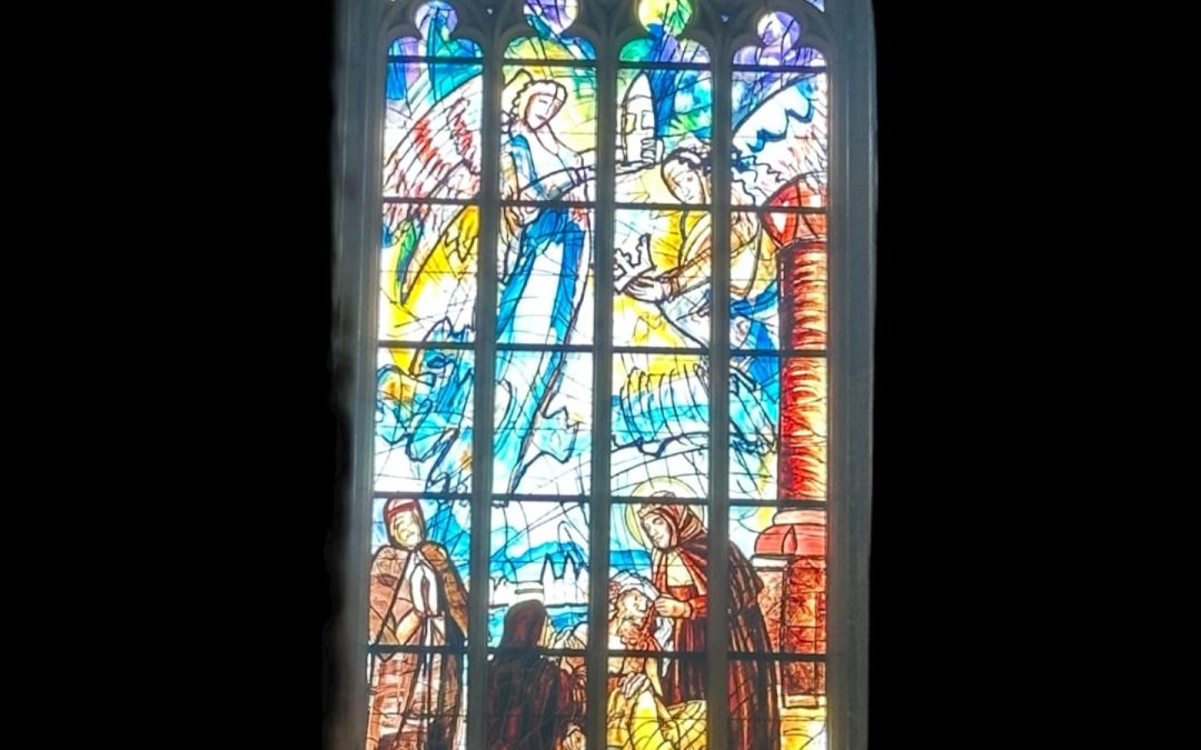 Gothic stained glass window at St. Barbara's Cathedral, glowing with colourful biblical scenes (1 of 10)